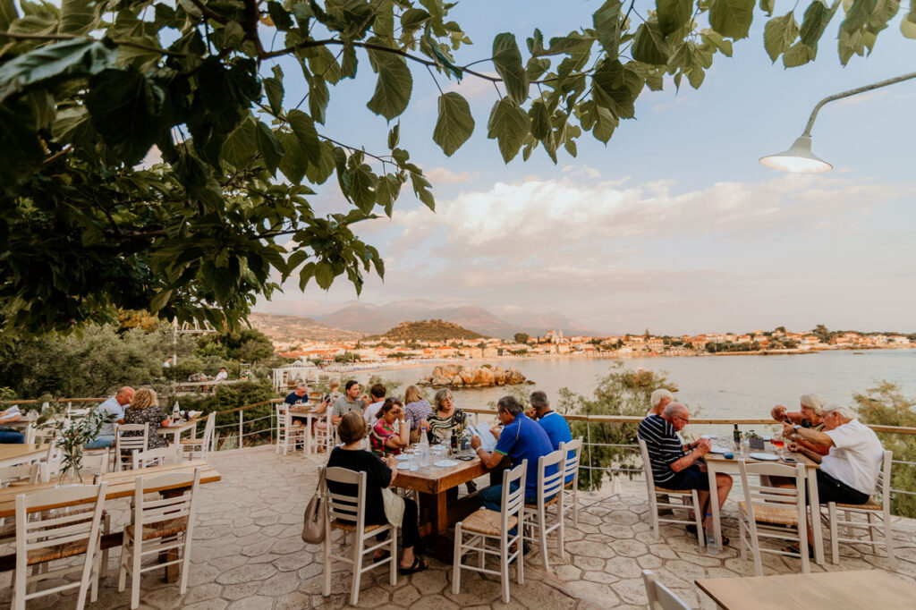 Seaside terrace at dusk overlooking Stoupa bay