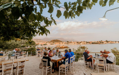 Seaside terrace at dusk overlooking Stoupa bay