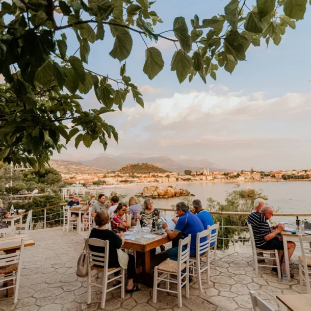 Seaside terrace at dusk overlooking Stoupa bay